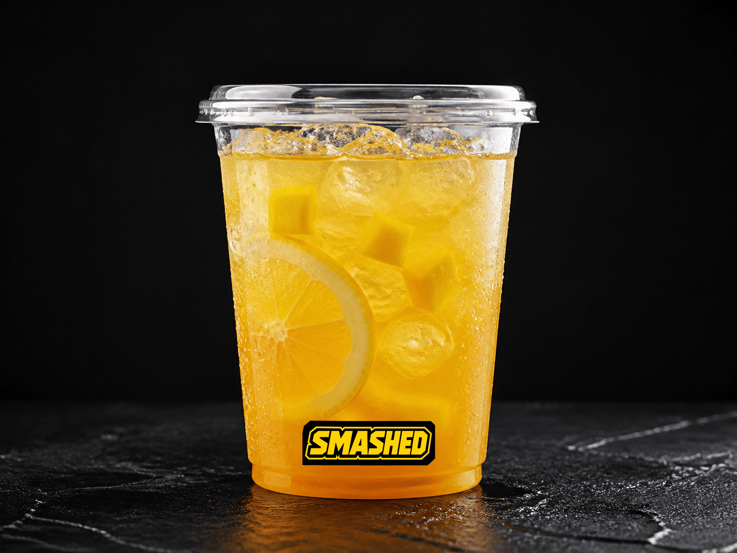 Mango lemonade in a branded clear cup